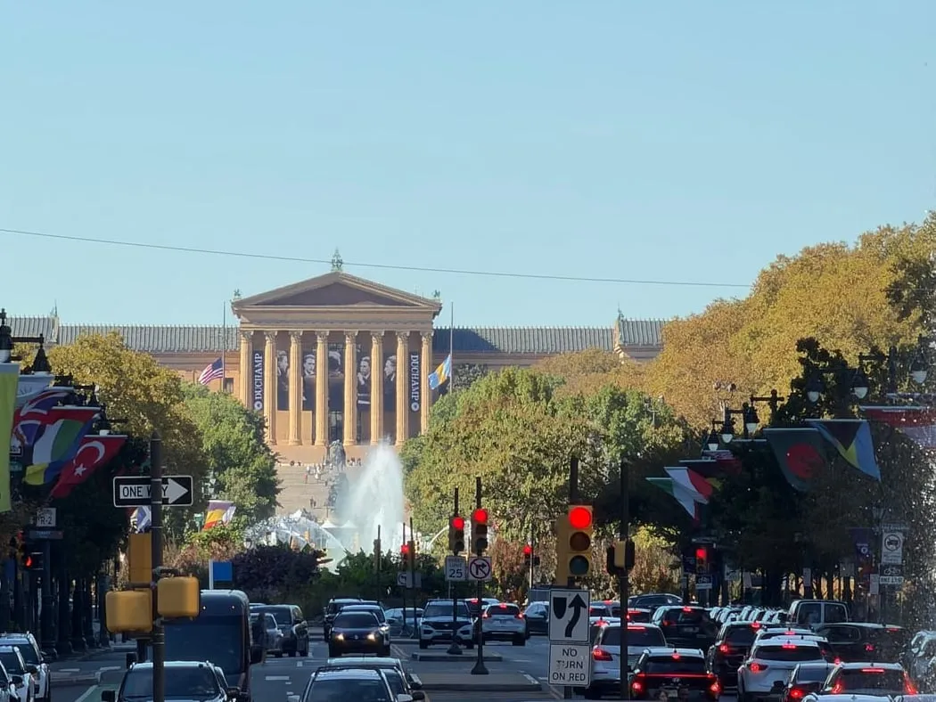 The Benjamin Franklin Parkway lined with international flags, leading to the Art Museum