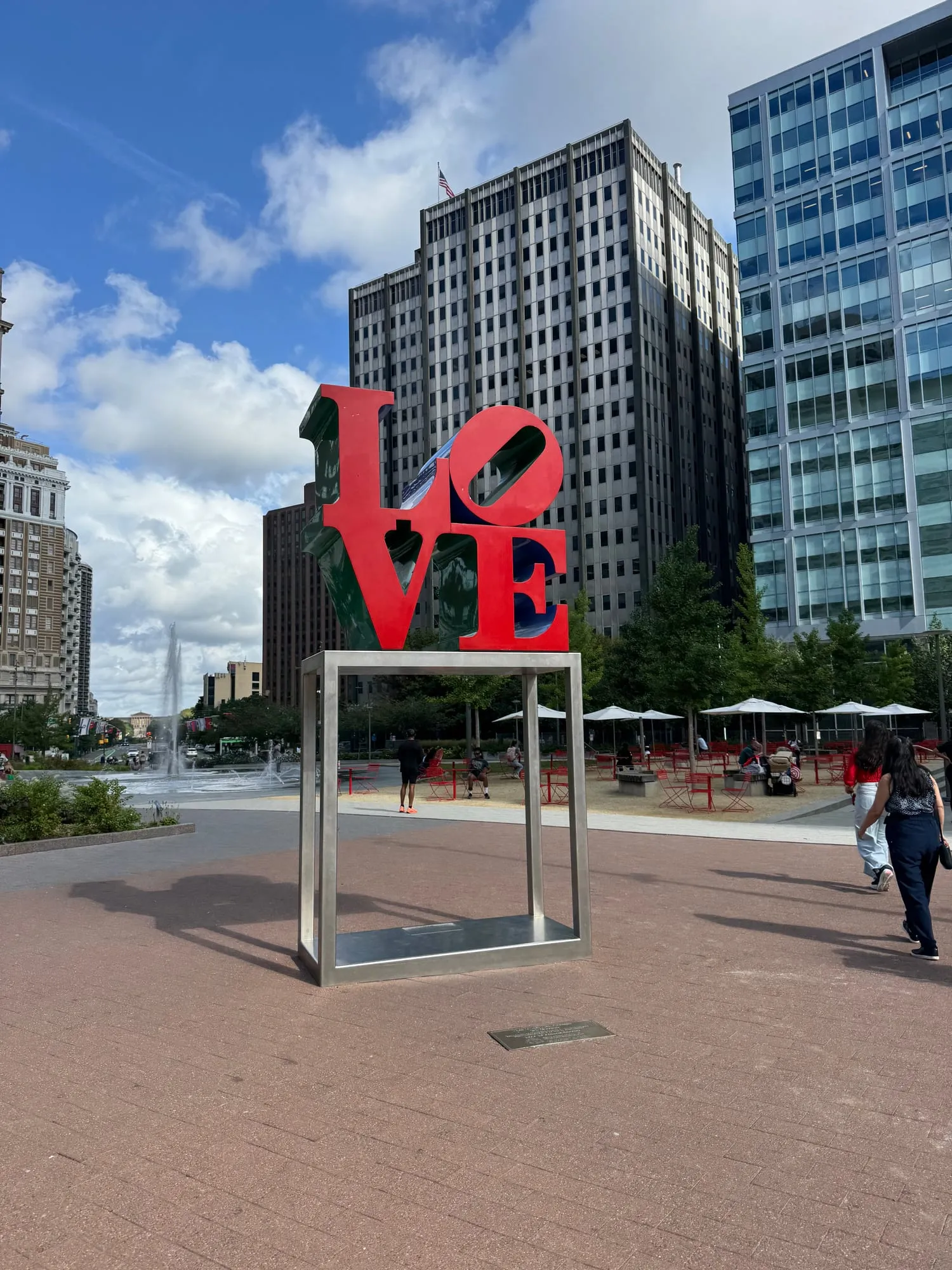 The red LOVE sculpture in LOVE Park, with city towers behind