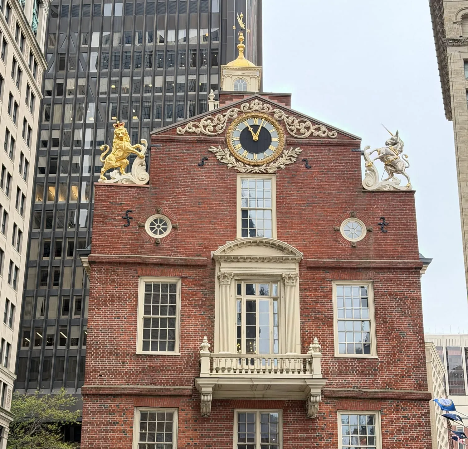 The Old State House's brick facade, clock and golden lion and silver unicorn statues